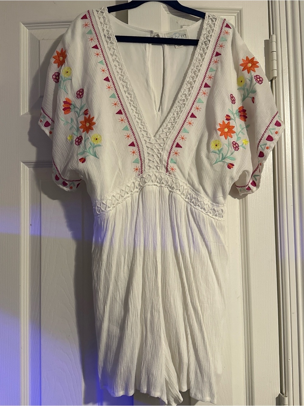White Embroidered V-Neck Romper with Floral Accents